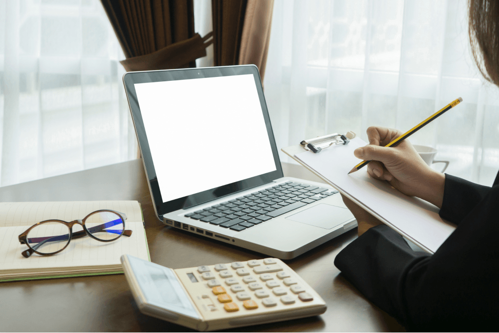 Laptop and calculator for bookkeeping services